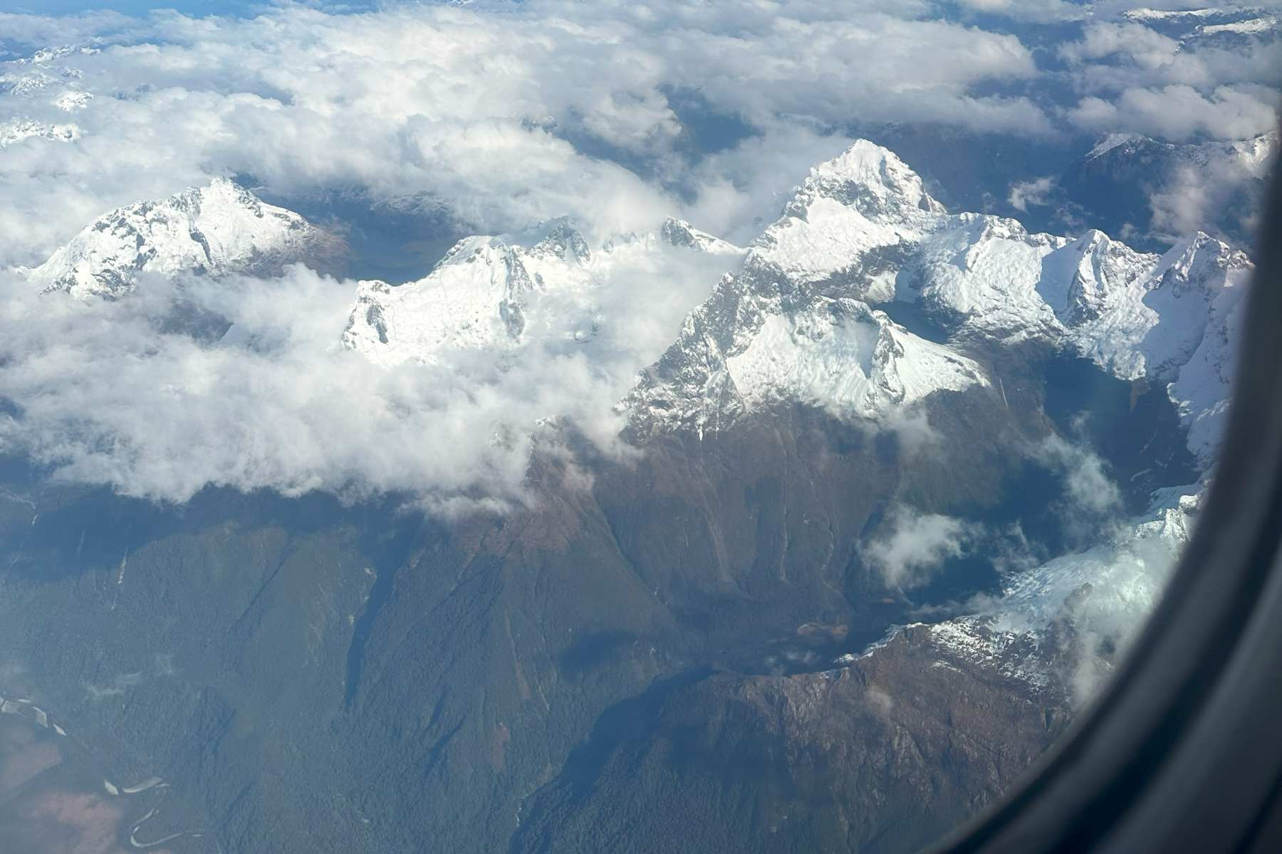 Queenstown snow capped mountains flying in