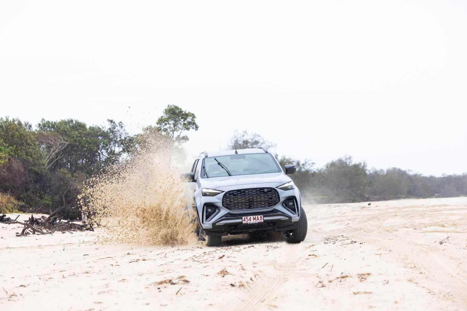 2025 Isuzu MU-X X-TERRAIN SlateGrey front quarter on sand 2