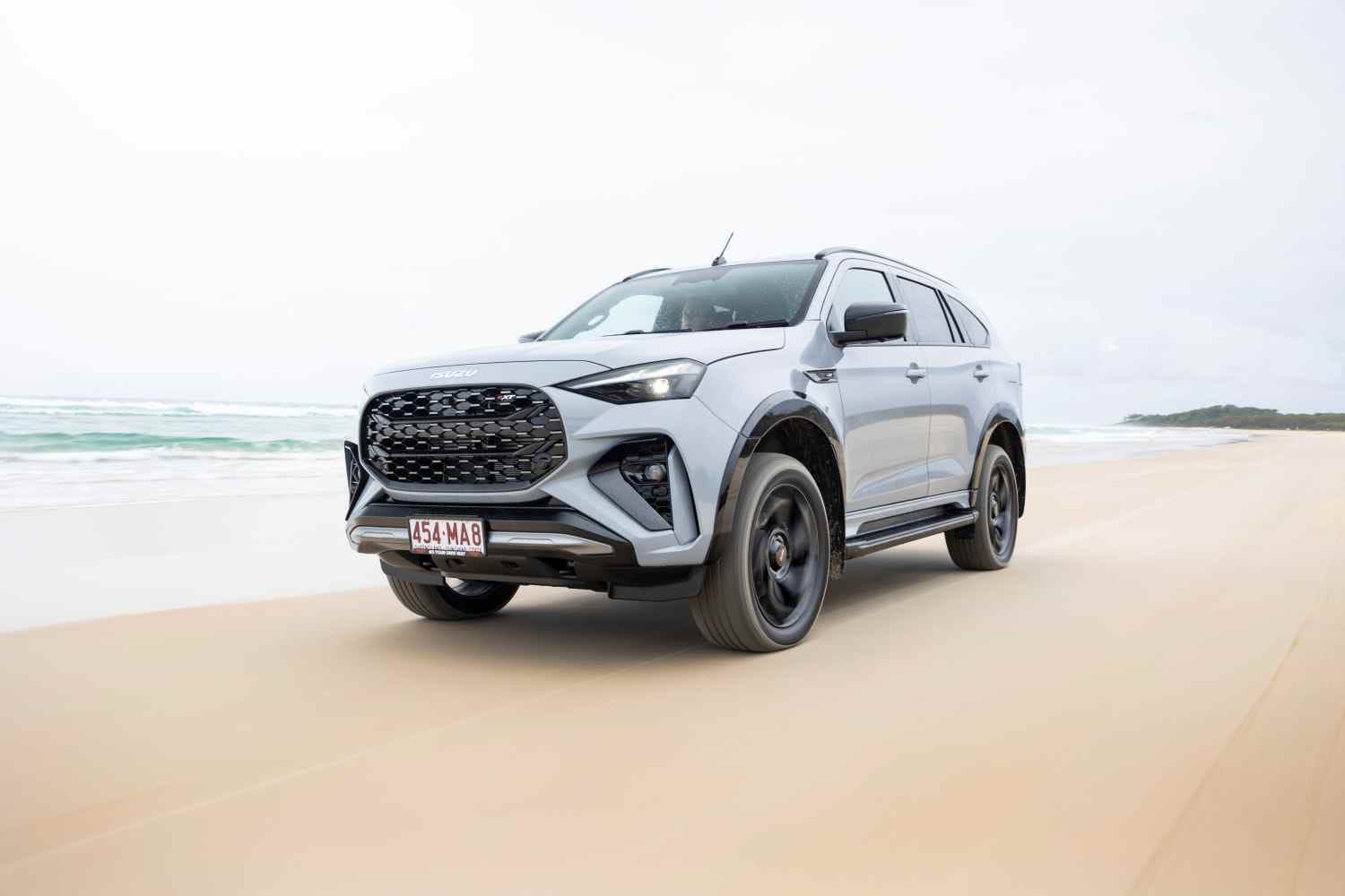 2025 Isuzu MU-X X-TERRAIN SlateGrey frot quarter on sand 1